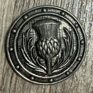 Thistle design kilt brooch. Measures 1.5” in diameter.